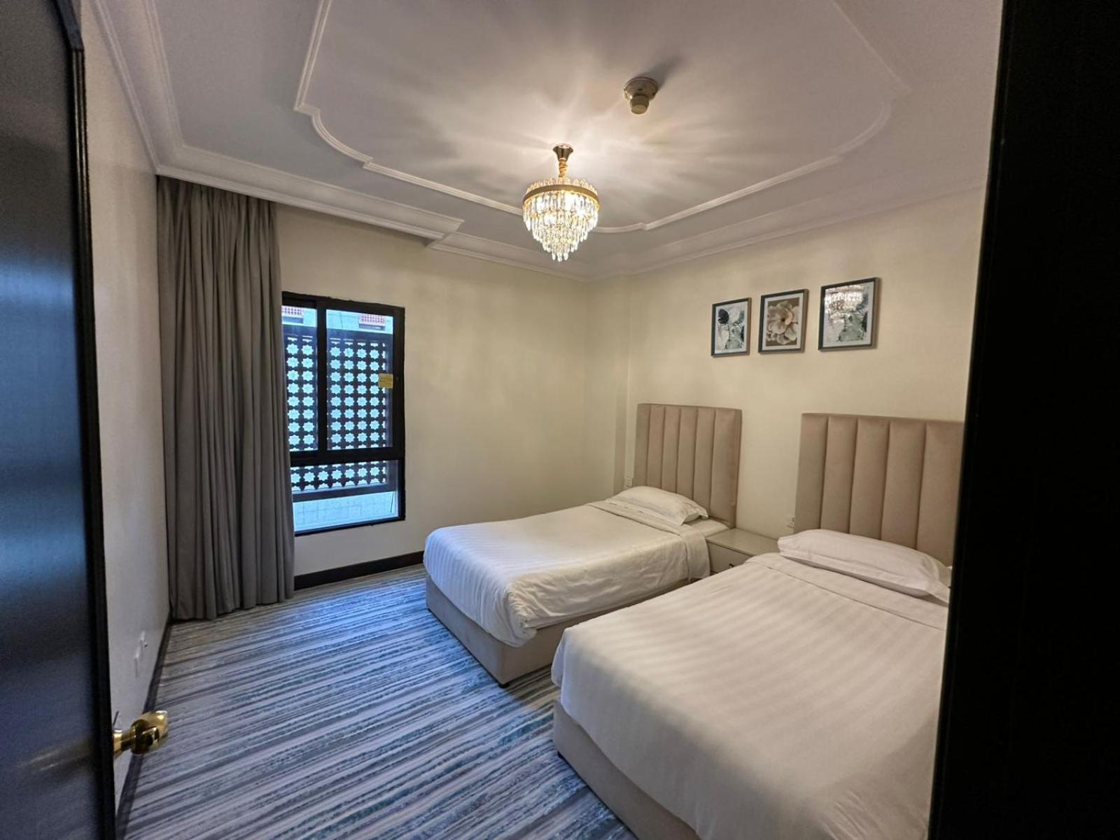 Zad Al Eman Suites Hotels Медина Номер фото